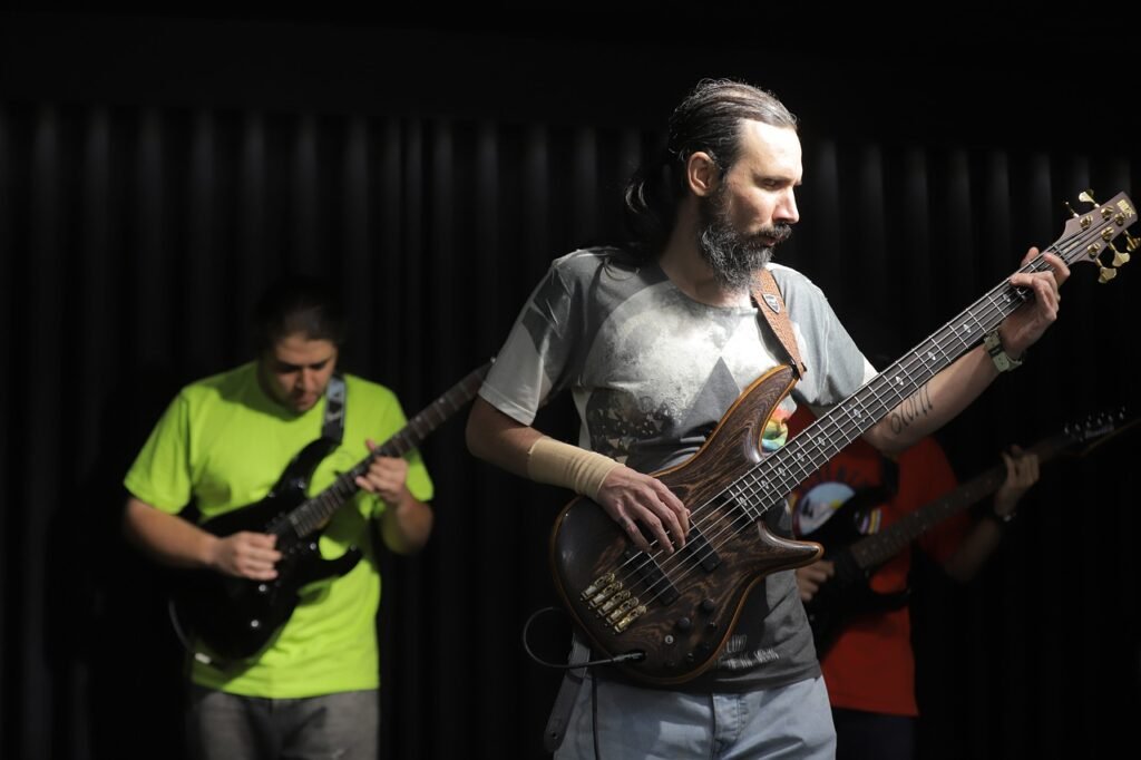 Live rock band, bassist playing guitar